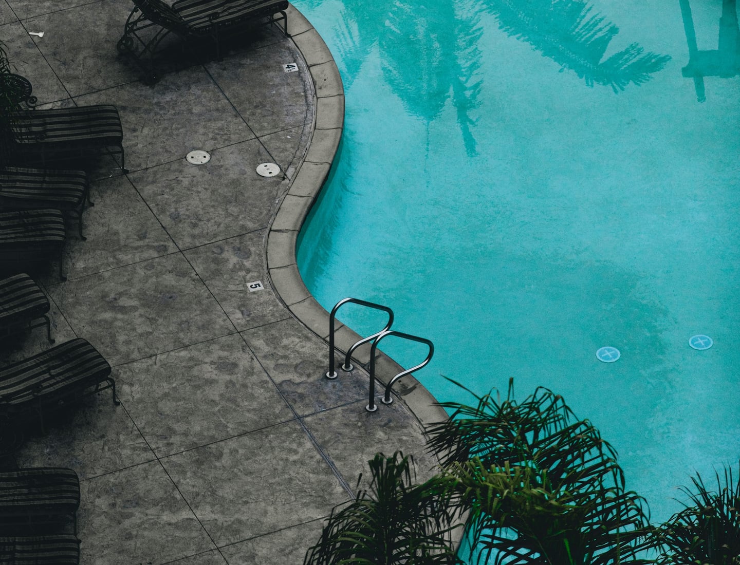 Aerial view of a blue swimming pool